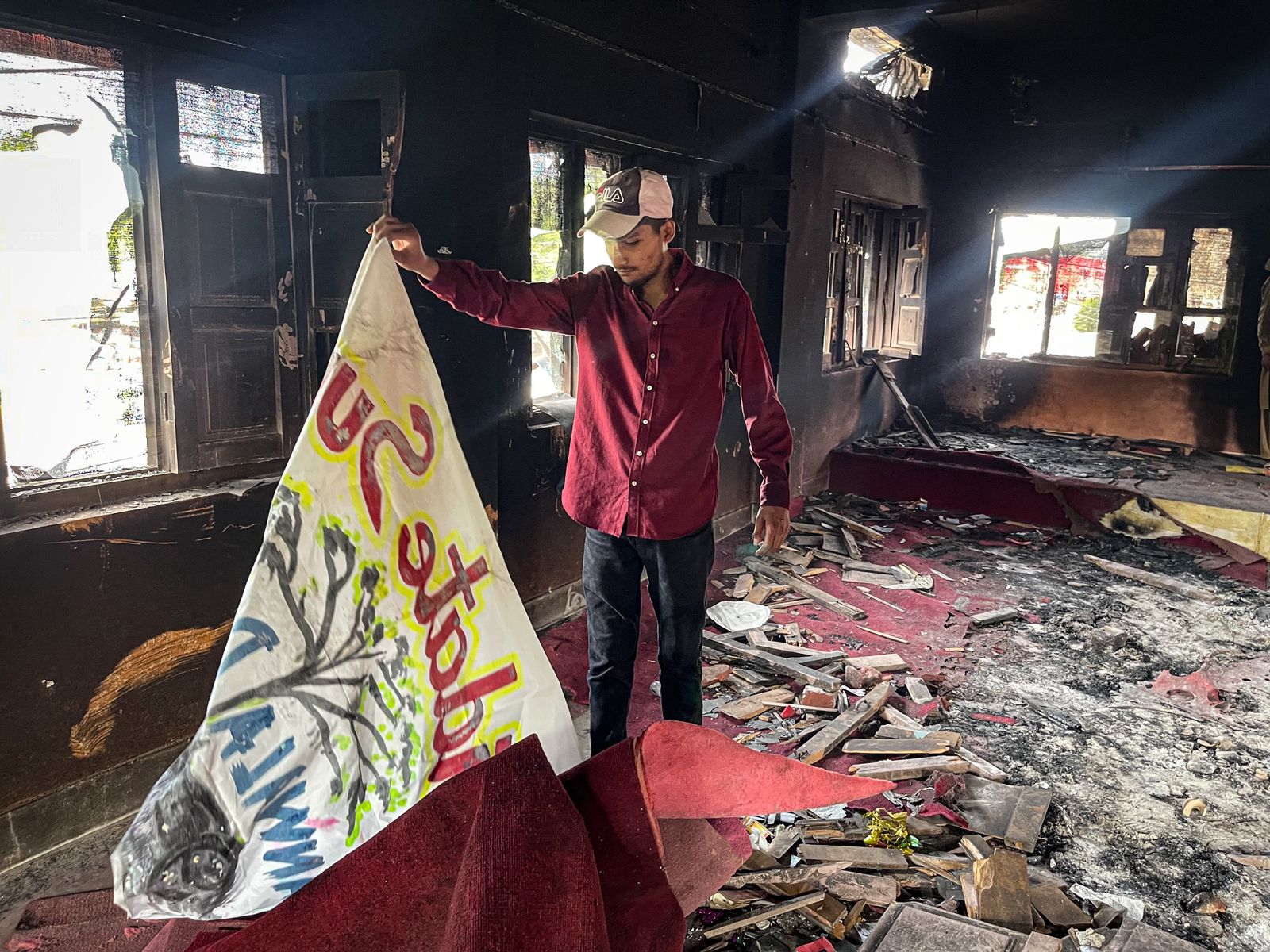 Sufyan in a Burned Down Church, working with Operation LIFE