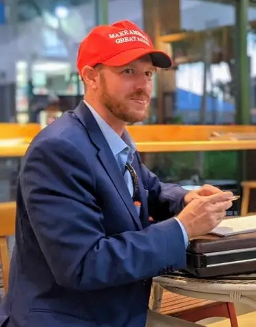 Francis Cook - Empowering American Citizens to Defend America's Freedom Francis Cook in MAGA hat e1726518624126