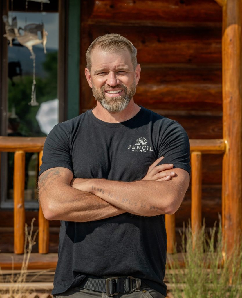 Brad Siler, owner of Pencil Log Pros, providing professional log home maintenance and restoration services in the Rocky Mountains.