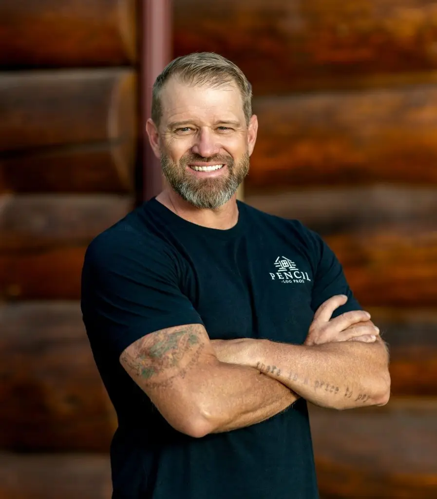 Brad Siler - Owner of Pencil Log Pros and a Leader in Log Home Restoration Brad Siler, founder of Pencil Log Pros, sitting confidently and representing his leadership in log home restoration and customer trust.